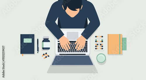 A person working on a laptop surrounded by office supplies and documents on a desk viewed from above