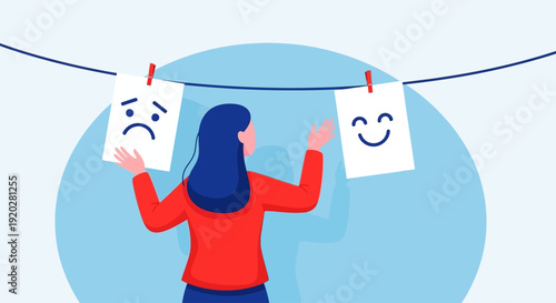 A person holding two cards with different emotions hanging on a clothesline, contemplating feelings and moods