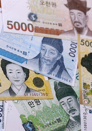 Fotografie South Korean won money bills pile on table