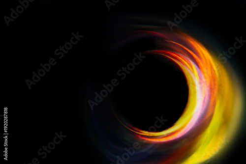 semicircular blurred yellow-red glare on a black background