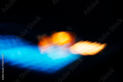 blue light flare with yellow and orange flashes, overlay effect