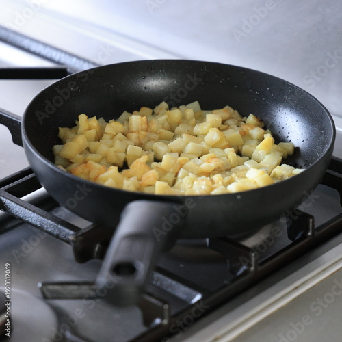frying pan with fried potatoes