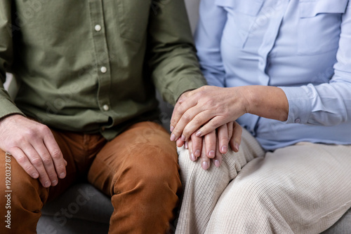 Принти на полотні Couple holding hands in a gentle close-up, showing comfort, trust and emotional