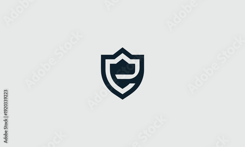 Modern geometric vector graphic illustration featuring a stylized dark symbol resembling a shield with an abstract letter "E" or "C" integrated within its protective design.