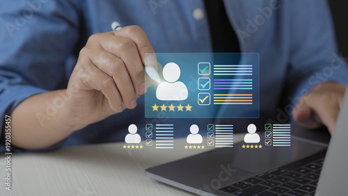 Business professional giving five star customer review on laptop with virtual feedback interface, online rating system, user experience evaluation, satisfaction survey 