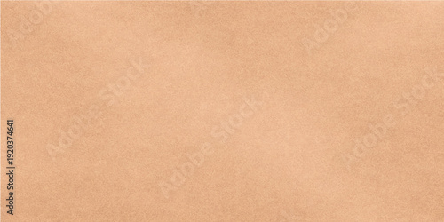 Old brown cardboard and aged parchment paper textures with a vintage grunge pattern on a rough blank surface create a classic antique beige material background for a weathered box or page design