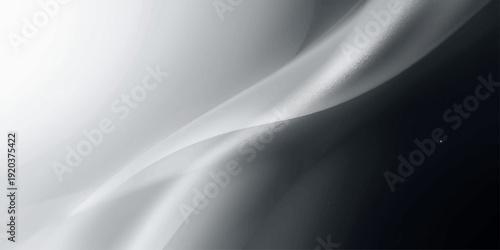 Luxury black and white satin fabric background with smooth flowing silk waves and soft material curves in a textile pattern abstraction for elegant wallpaper design