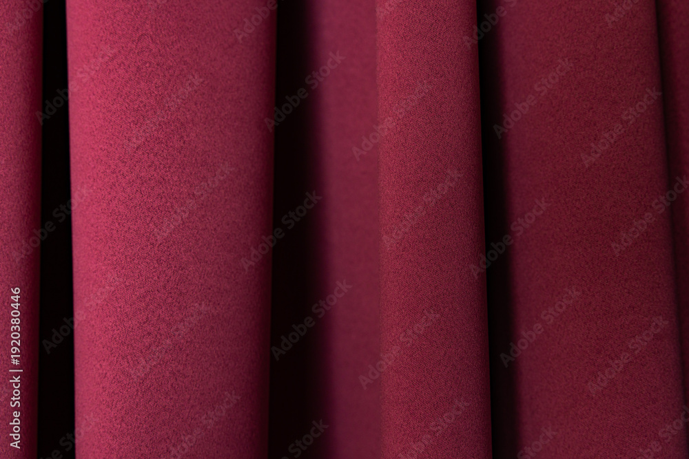 Fototapeta premium Macro Texture of Burgundy Fabric Curtains with Soft Vertical Folds