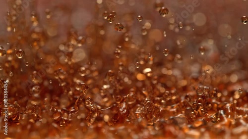 Fizzy Soda Splashes And Creates Standing Waves, Abstract Brown Liquid In Macro and Slow Motion