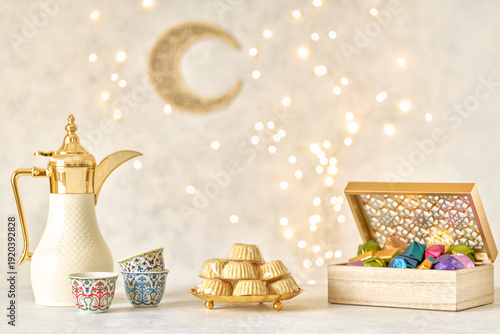  Semolina maamoul cookies , colorful chocolate candies with dallah and ramadan decor . Traditional arabic Eid al Adha, Eid al Fitr , Ramadan sweets	