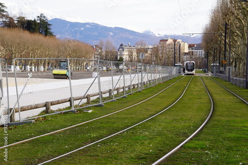 Grenoble France February 18 2026 Urban redevelopment works at Esplanade district with excavators infrastructure installation Tram E line future city park transformation and Foire des Rameaux event 