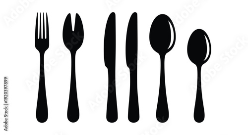 Black flatware arrangement depicting dining utensils in a stark silhouette