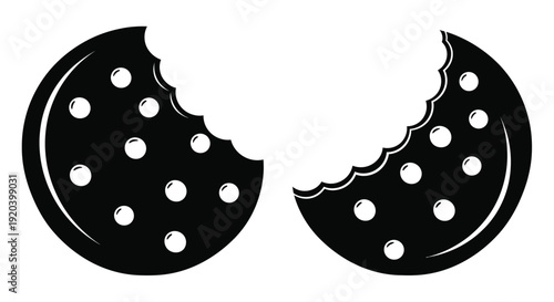 Two chocolate chip cookies one with a bite taken in silhouette