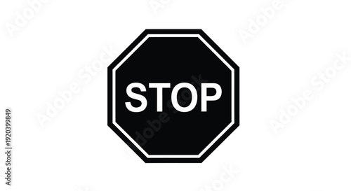 A classic black stop sign with bold lettering a striking silhouette