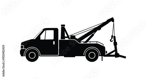Black tow truck illustration with a simple striking silhouette