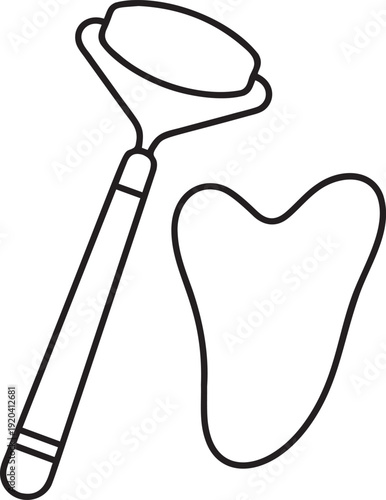 Facial massage tools including a jade roller and gua sha stone, beauty instruments for skincare routine