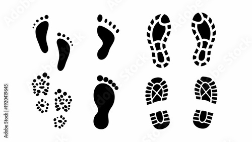 Collection of various black footprints and shoe sole impressions on white
