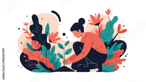 Dedicated young woman in a garden kneels on the ground to carefully plant a new green sapling among various large tropical leaves.