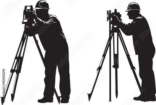 Two surveyors in hard hats using theodolites on tripods surveying construction