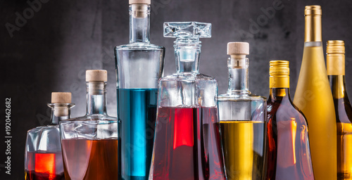 Schilderij op canvas Carafe and bottles of assorted alcoholic beverages.