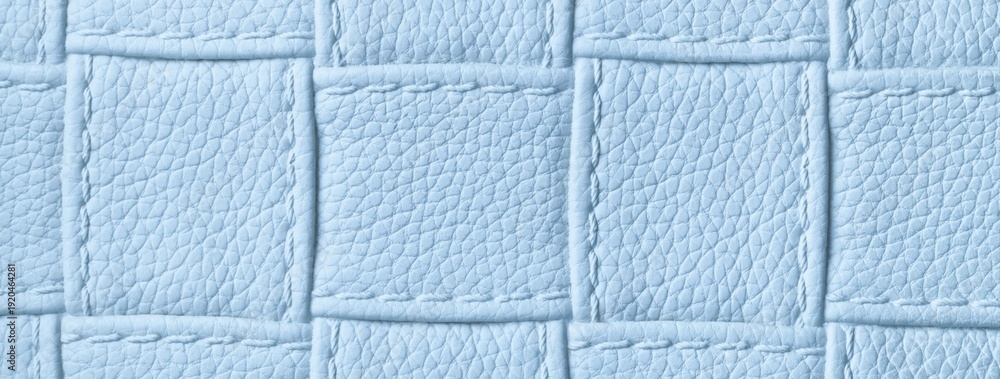 Fototapeta premium Texture light blue leather background with quilted stitched pattern, macro. Abstract pastel upholstery surface