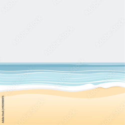 Ocean waves gently washing ashore on a serene sandy beach under a pale sky
