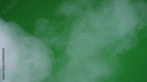 White smoke effect on green screen background.