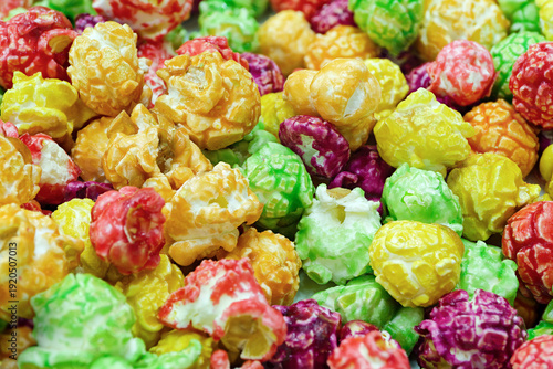 Pile of sweet popcorn covered with glaze of various colors