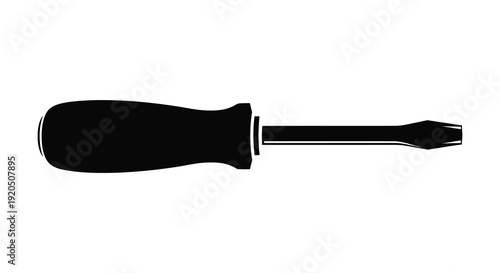 A stark black silhouette depicts a common hand tool a flathead screwdriver against a white background silhouette high quality