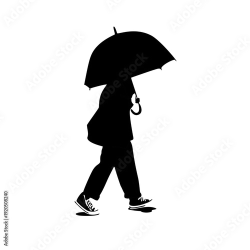 silhouette of a person walking using an umbrella