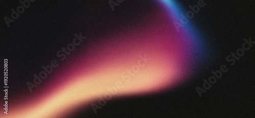 Obraz na plátně Abstract light leak overlay with a soft gradient of warm orange, magenta, and cool blue hues on a dark background, featuring subtle film grain texture