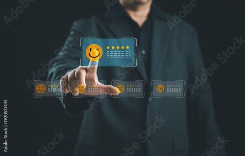 Photos Company executive selecting five star customer rating on digital feedback interface