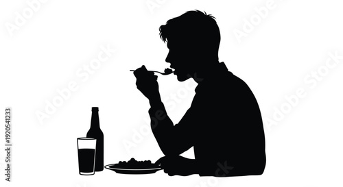 Silhouette of a man dining with a bottle and glass nearby
