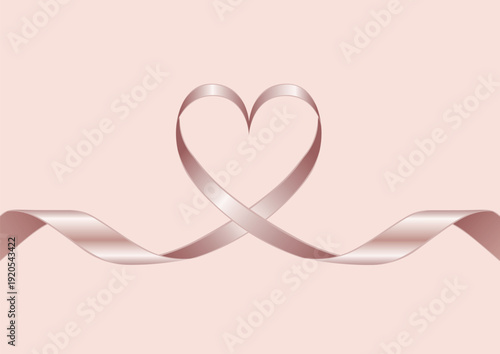 Elegant rose gold ribbon forms heart shape on soft pink background symbol love romance elegant gentle
