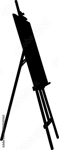 Artist easel silhouette standing in a studio perspective