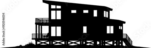 Modern beach house silhouette elevated on wooden stilts