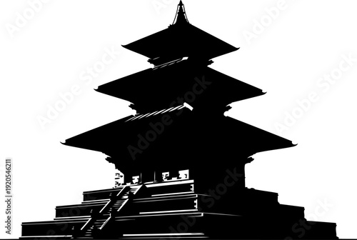 Multi tiered pagoda silhouette standing on a stone base with stairs