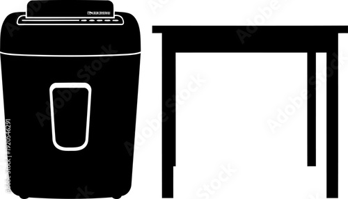 Paper shredder silhouette standing next to a table