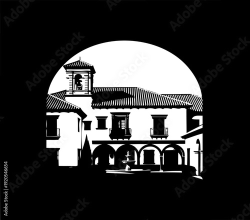 Spanish mission courtyard silhouette viewed through a large stone archway