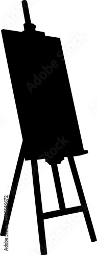 Standing artist easel silhouette holding canvas in studio