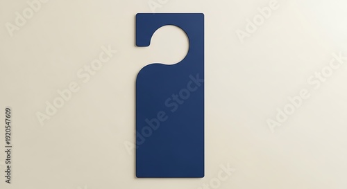 A plain dark blue door hanger sign with a cutout for the handle.