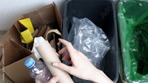 Woman Sorting Waste for Recycling