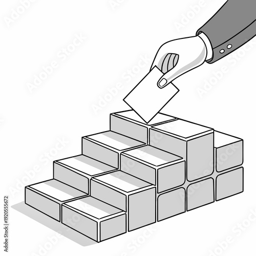 Hand placing block on stack of industrial blocks