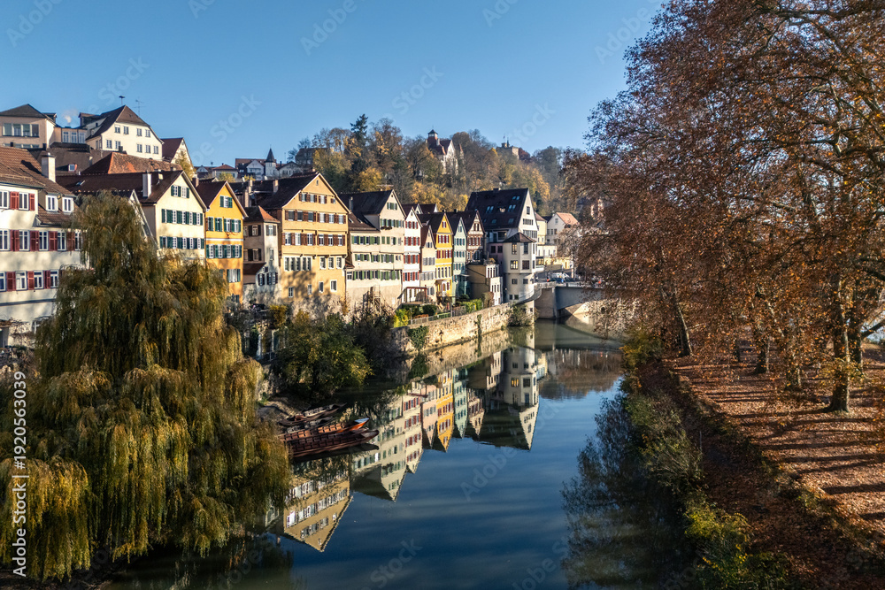 Fototapeta premium Drone shot of the Neckar River and old town of Tübingen in Southern Germany in autumn
