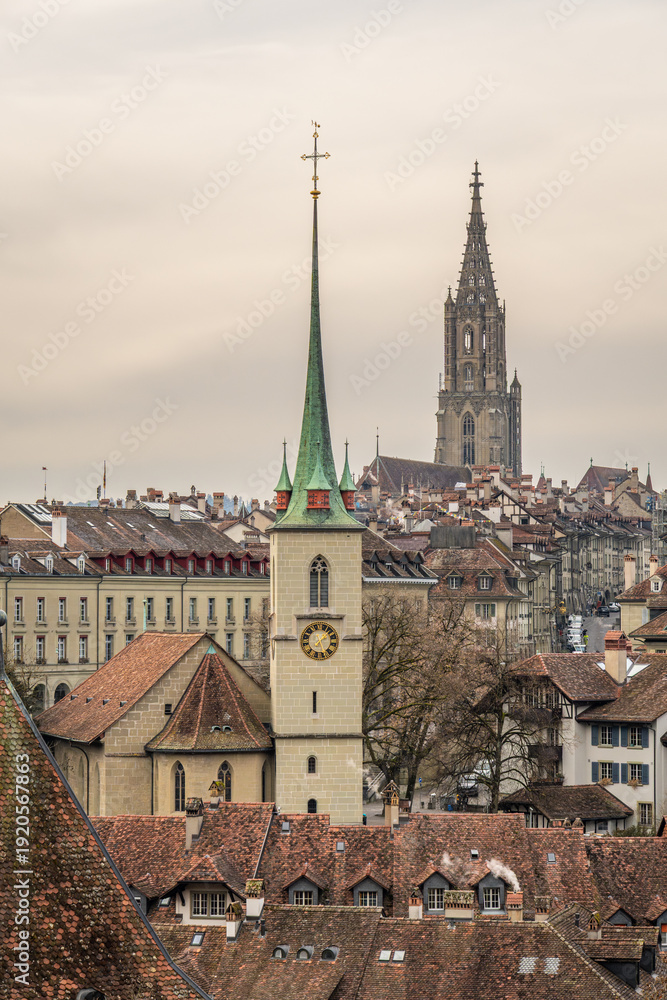 Fototapeta premium Cityscape of Bern Old Town on Cloudy Day. Berner Munster Cathedral. Switzerland