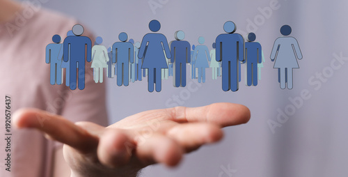 Hand holding figures repres...