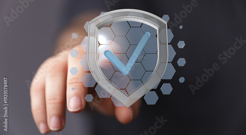 Fotografi Person's hand touching a digital security shield with a check mark, representing