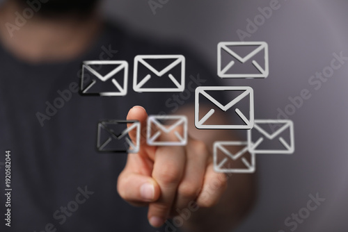Hand touching email icons, ...