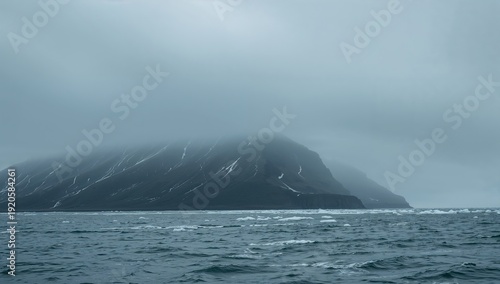 Dark Island Silhouette Under Cloudy Sky Near Cold Water Body in Arctic Region