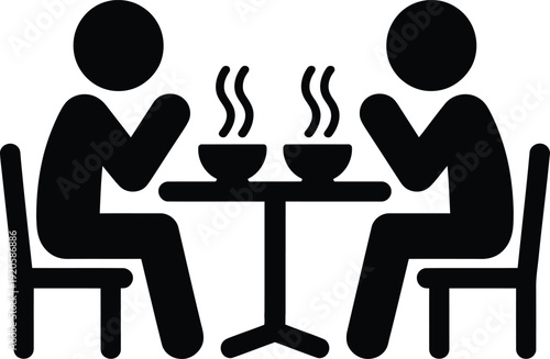 Two people sitting at a table eating steaming bowls of food